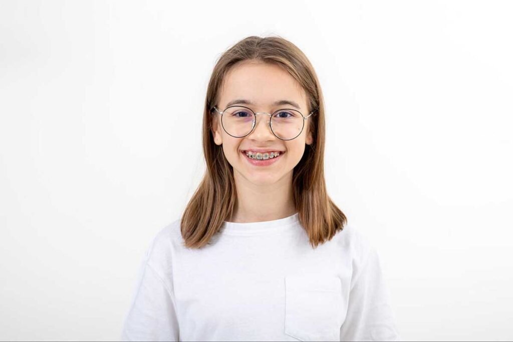 Young girl wearing an orthodontic extender